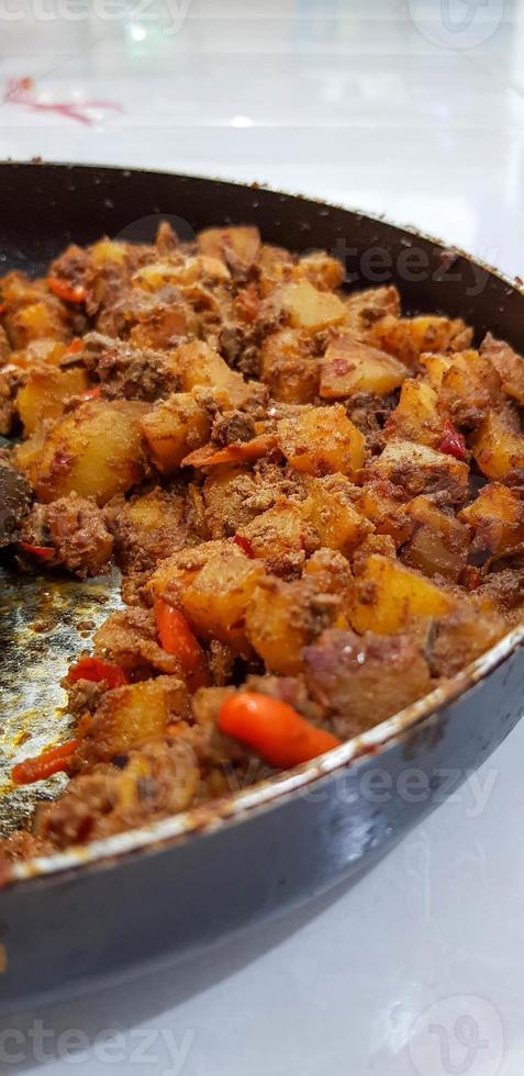 Sambal fried potatoes and chicken liver. Indonesian spicy food. photo