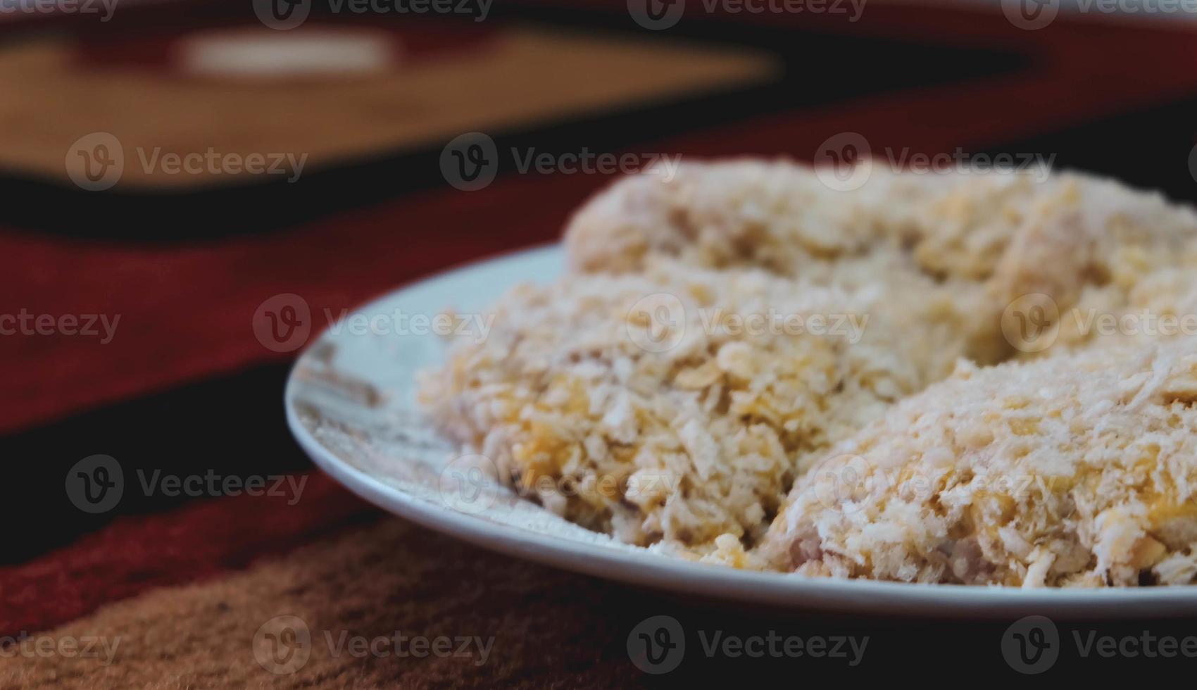 Chicken coated with breadcrumbs is ready to be fried,. photo