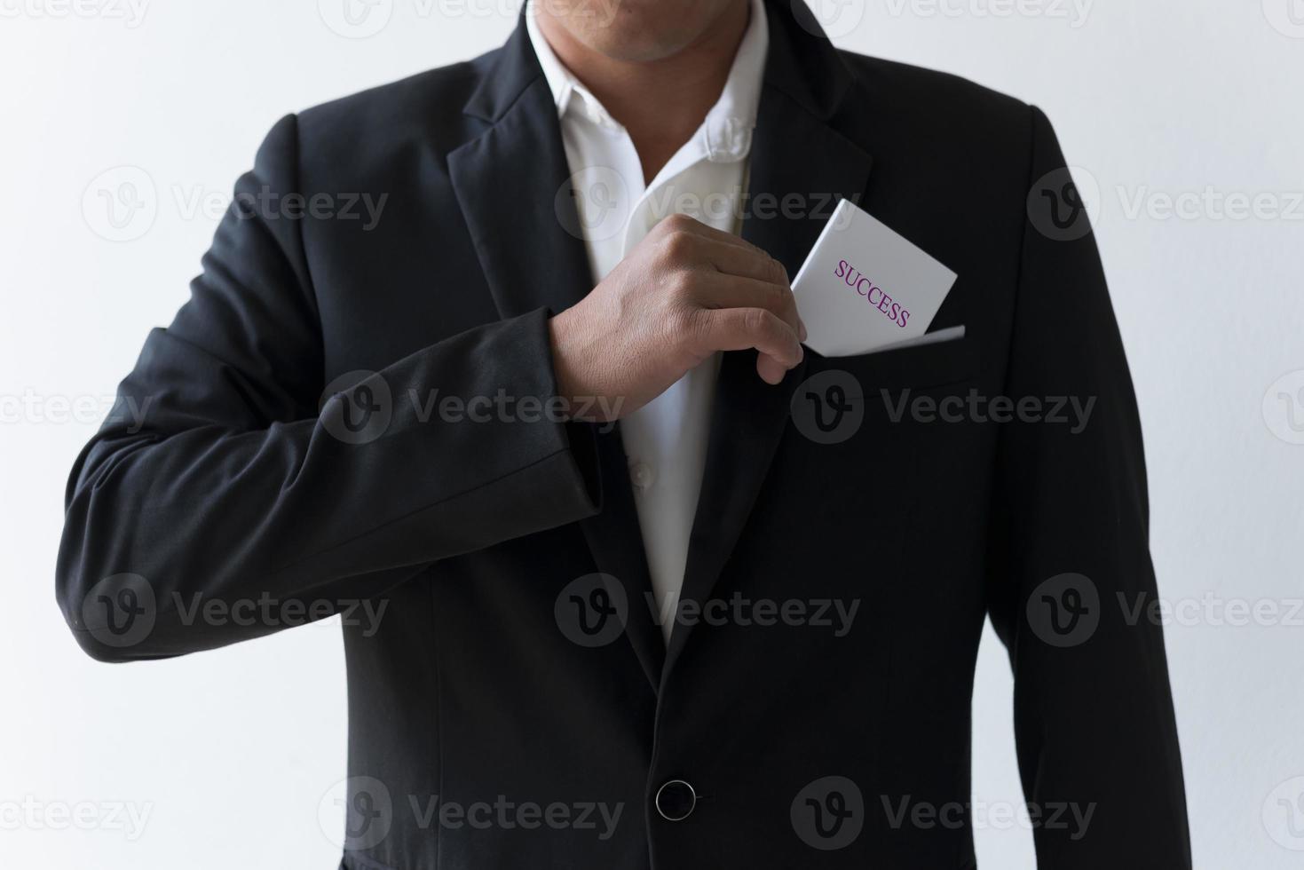 Successful businessman showing a card - photo