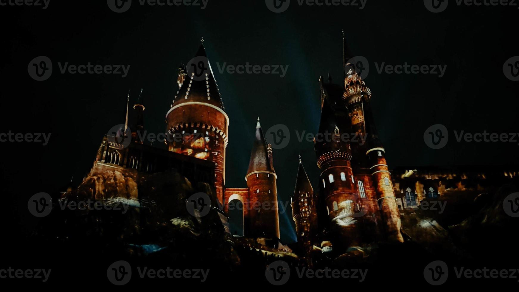 Osaka, Japan on July 8, 2019. A very beautiful light show at night at Hogwarts Castle featuring the four dormitories. photo