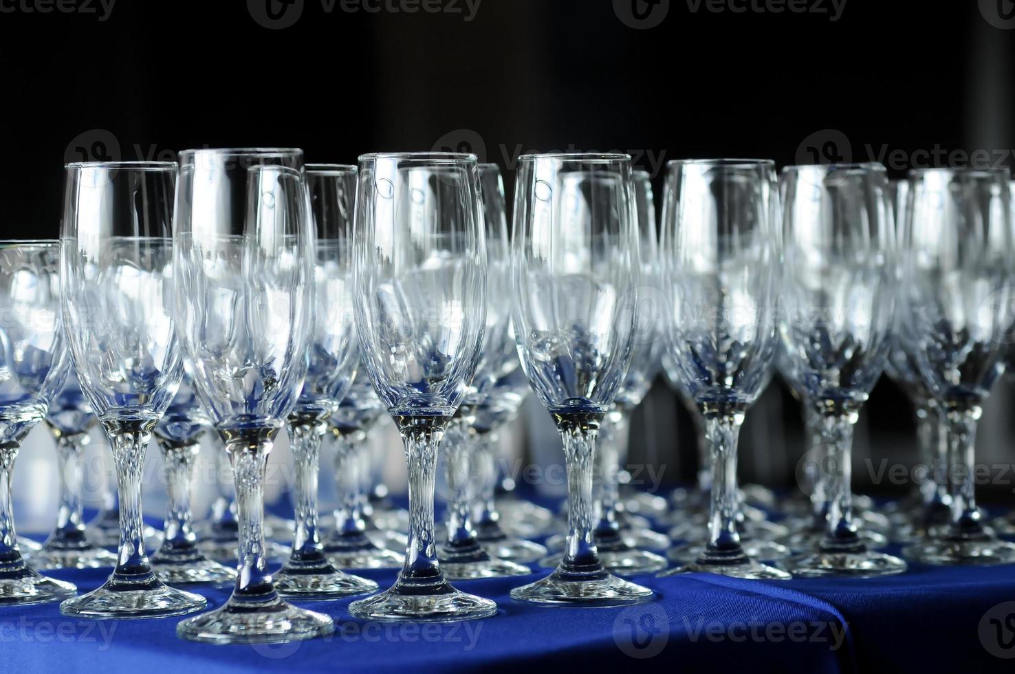 Many wine glasses on a party table photo