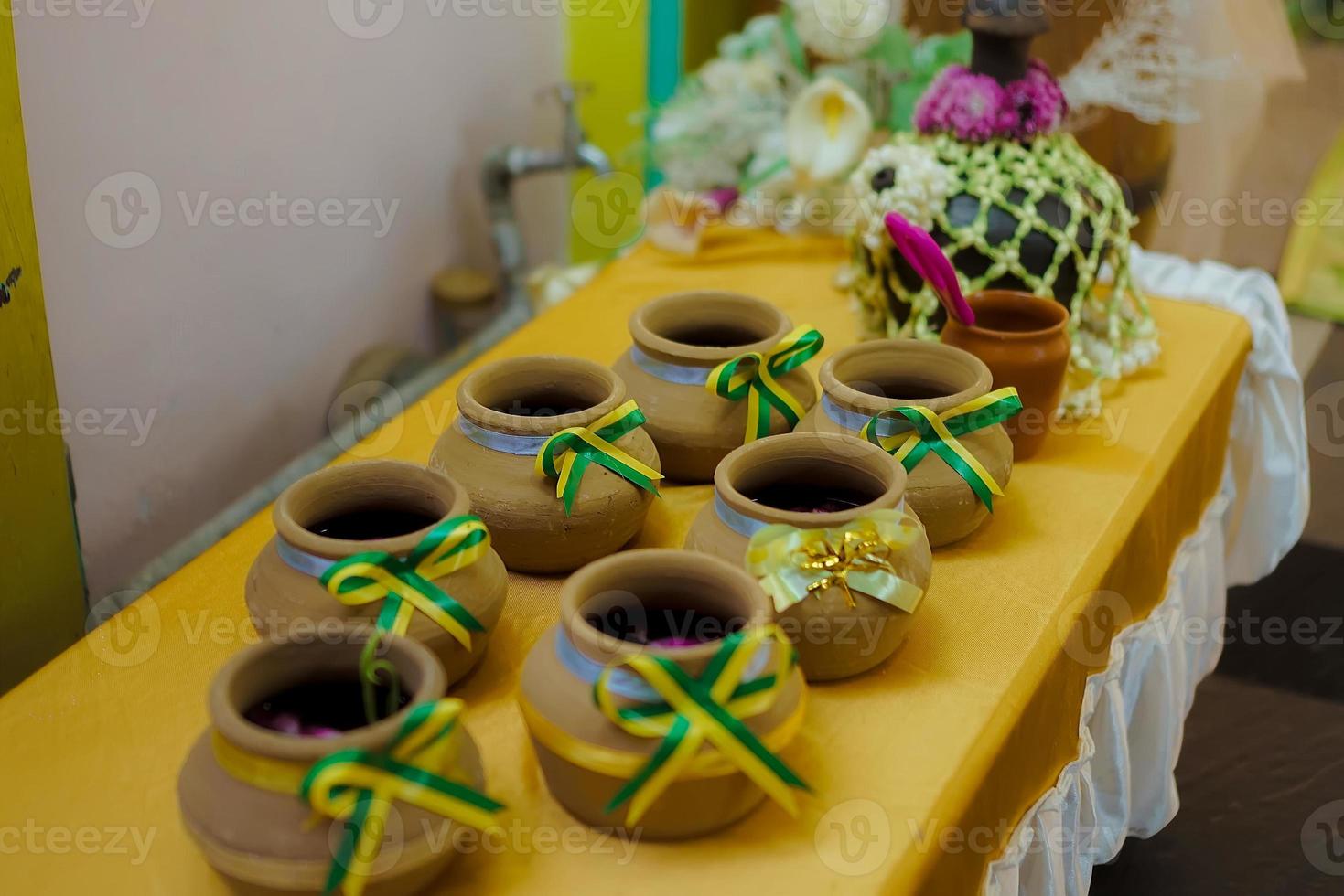 Kendi or pot. Kendi is a container or pot that is often used to store water for bathing or drinking water photo