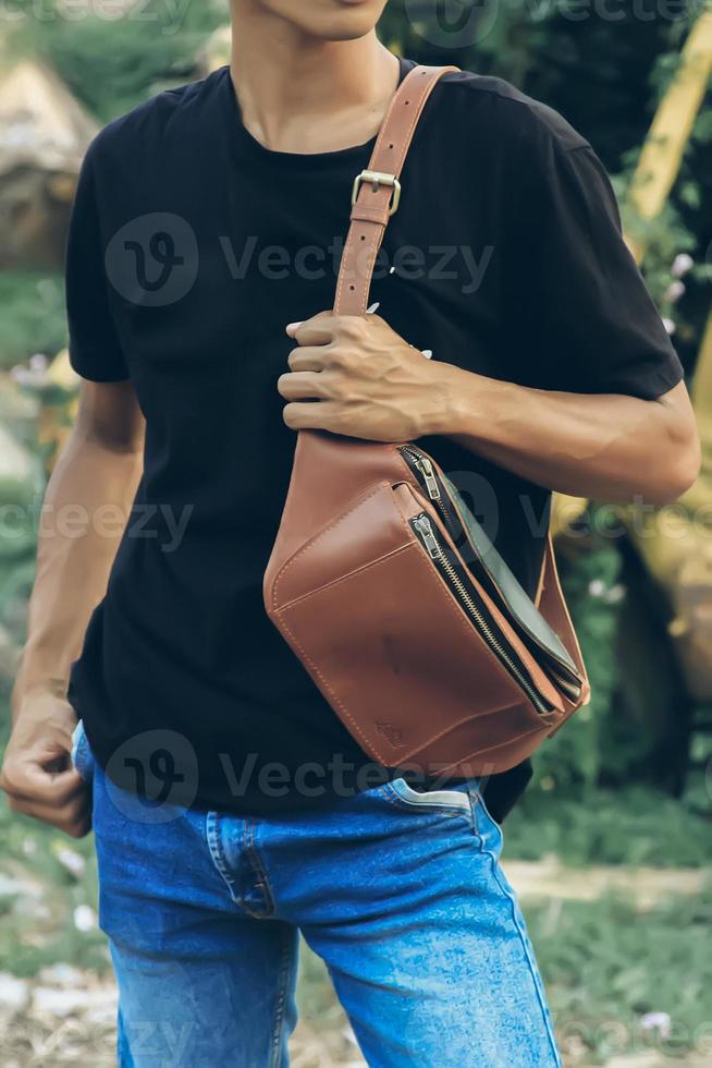 Leather Bag. A handbag or sling bag made of brown leather in a minimalist style or a minimalist and luxurious retro color. photo