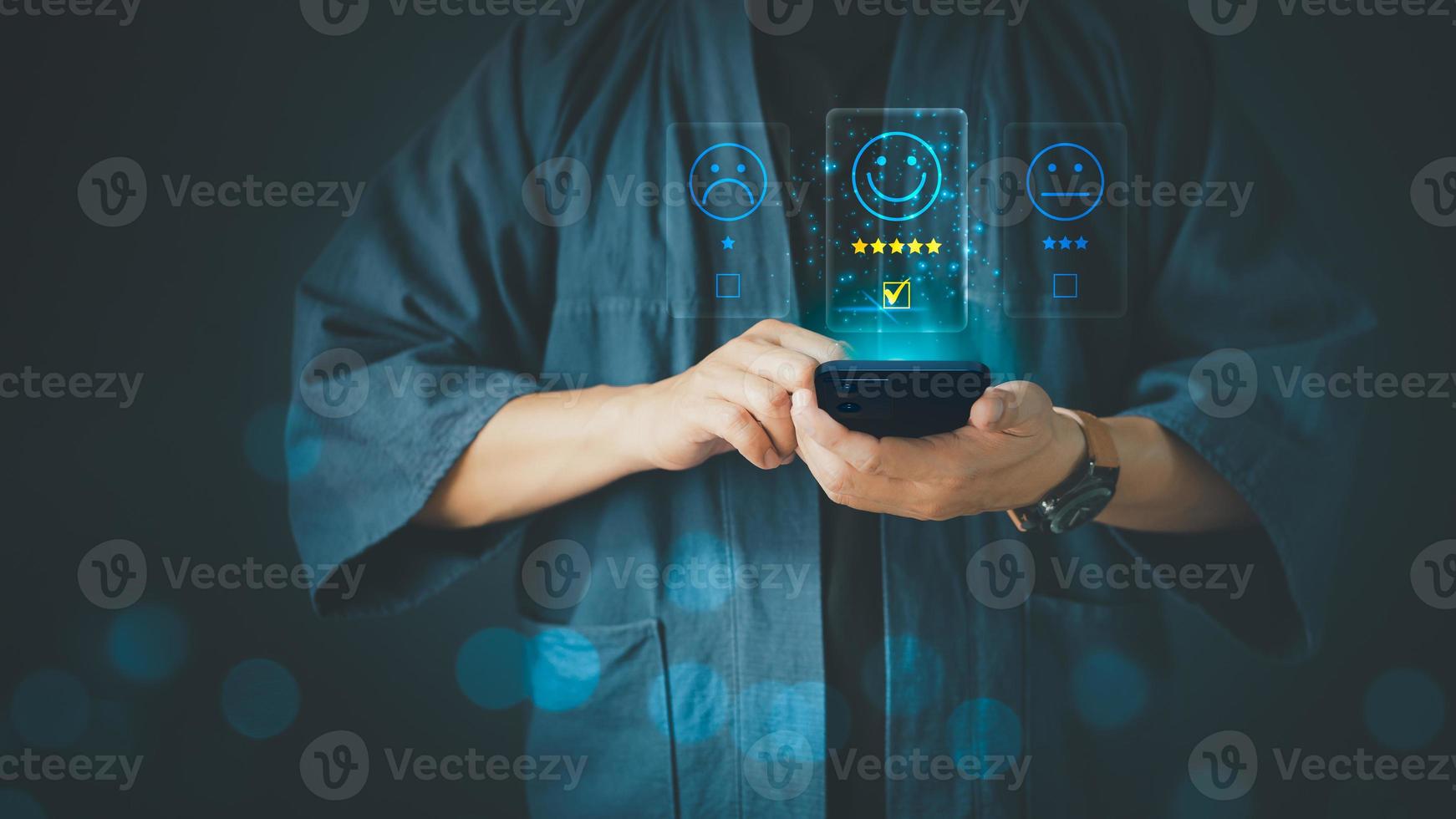 Man using a smartphone in give rating to service experience on application. Online customer review satisfaction feedback survey. photo