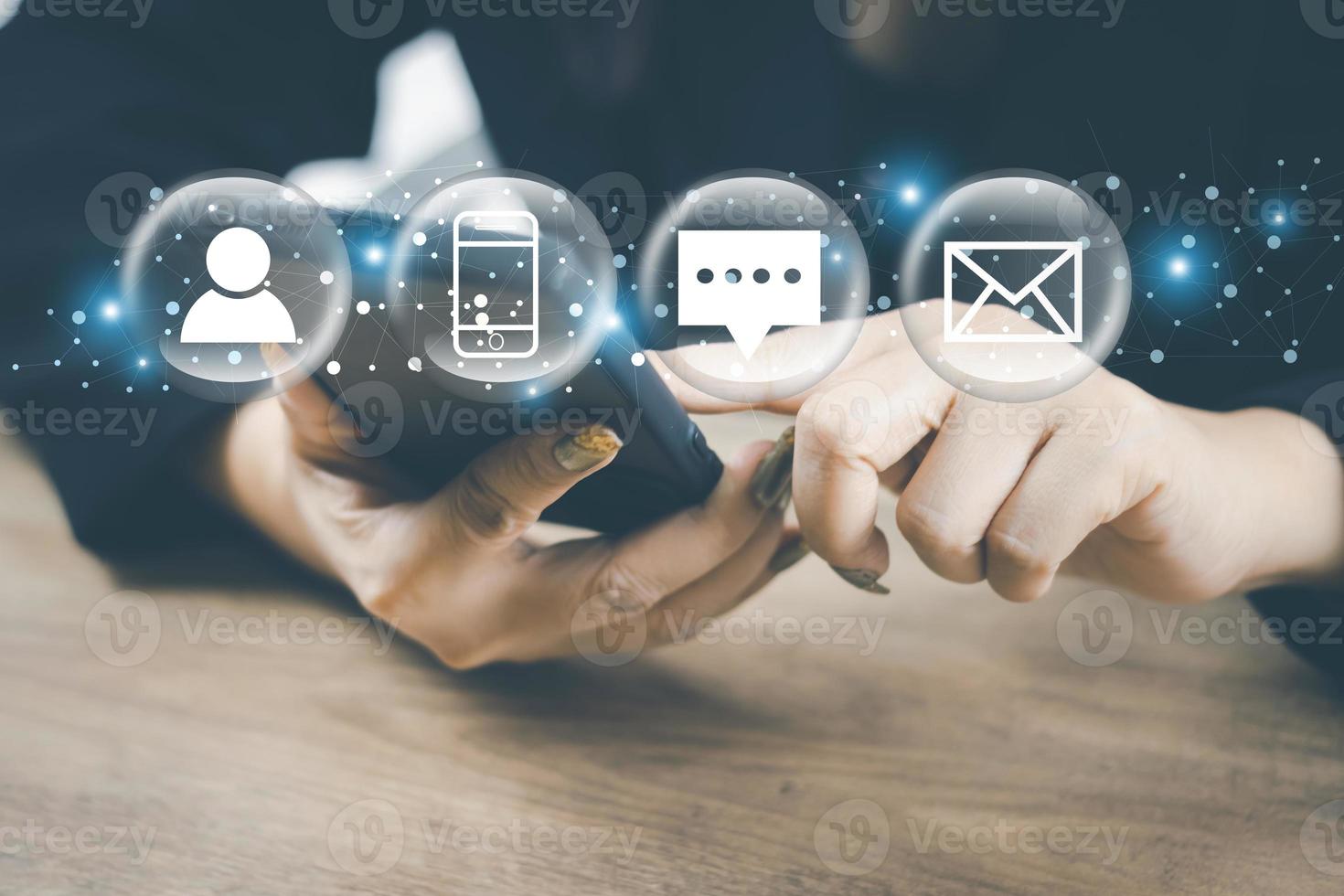 Customer support hotline Contact concept Customer service representative's hands are filling out information from mobile phone to computer. and notify the contact address to the service use photo