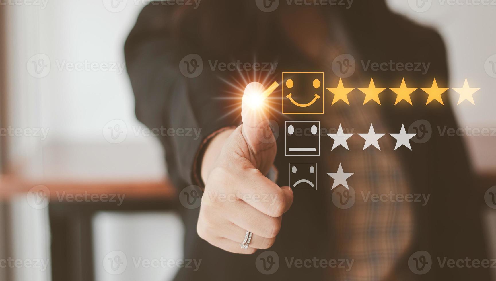 Customer service and Satisfaction concept Men's hands doing online assessments in the satisfaction rating the popular service company allows customers in order to improve and develop the organization photo