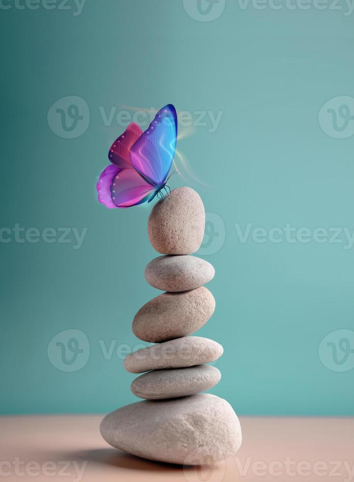 armonía del concepto de vida. mariposa surrealista en la pila de piedra de guijarros. metáfora de equilibrar la naturaleza y la tecnología. calma, mente, vida relajante y vivir por naturaleza. imagen vertical foto