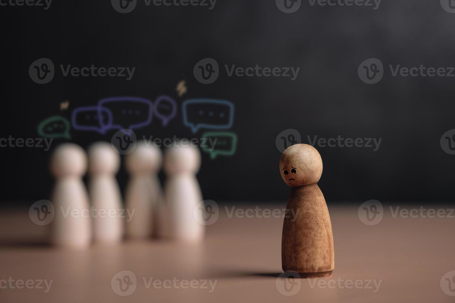 Bullying and Racist Concept. World Social Issue. Sad Person being Bullied from others. Parody and Intimidation. Doing or Saying Bad. presenting by wooden dolls photo
