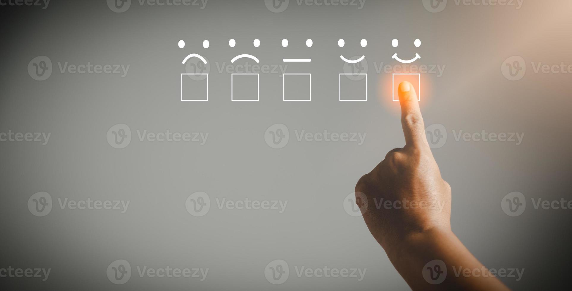 Customer service and Satisfaction concept, Business person are touching the virtual screen on happy Smiley face icon to give satisfaction in service. rating very impressed. customer service feedback. photo