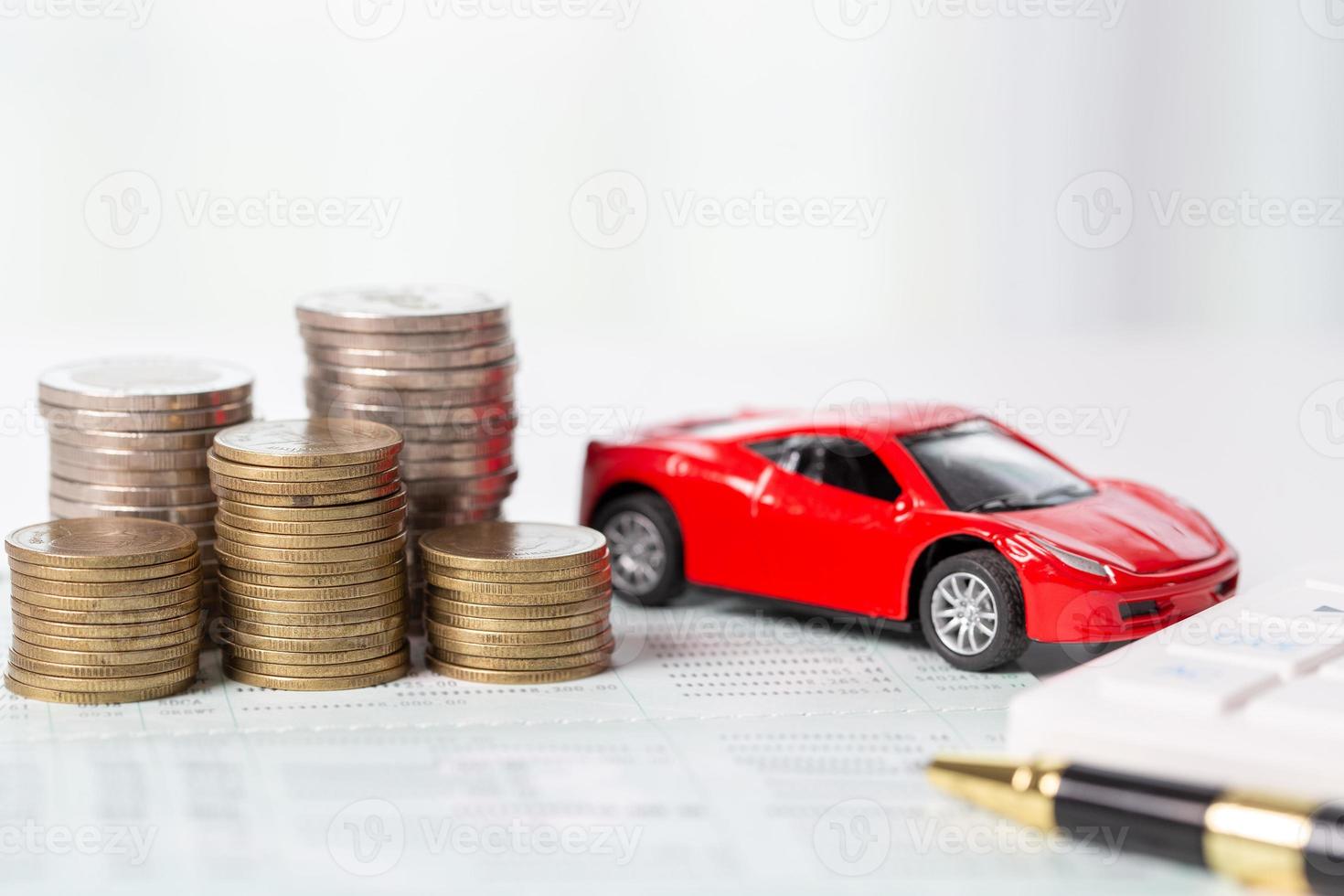 Car toy vehicle with stack coin money on background. Planning to manage transportation finance costs. Concept of car insurance business, saving buy - sale with tax and loan for new car. photo