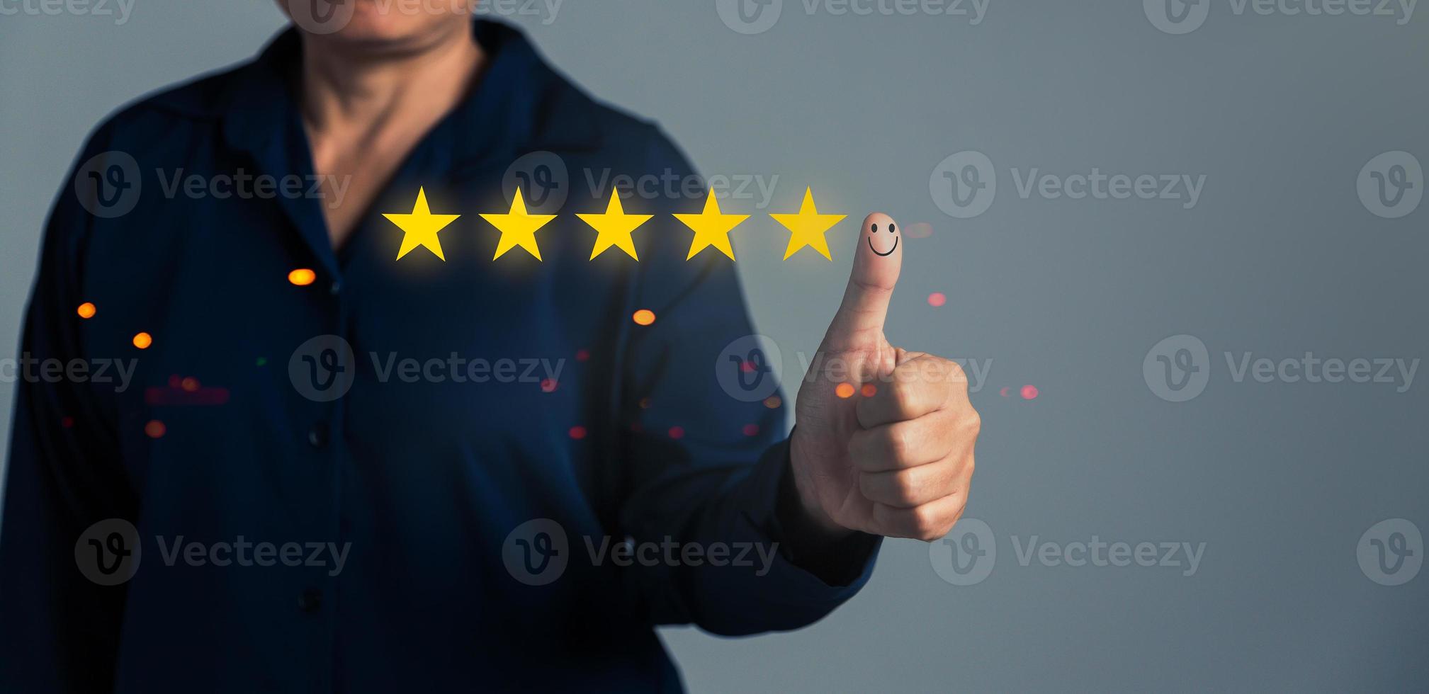 Hand with thumb up positive emotion smiley face icon and 5 star with copy space. Emotional smiley faces showing excellent satisfaction. rating very impressed. Customer service and satisfaction concept photo