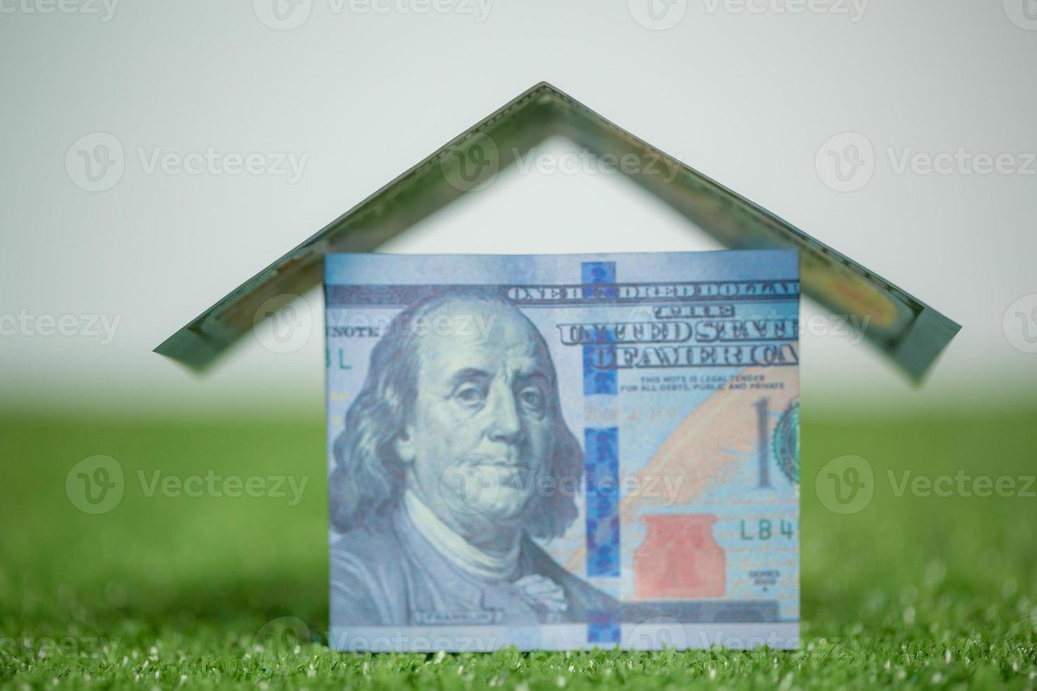 house property mortgage with cash money dollar bill on table concept of business finance, saving for buy home, investment loan, american currency, sale estate, bank payment, sell-rent real estate photo