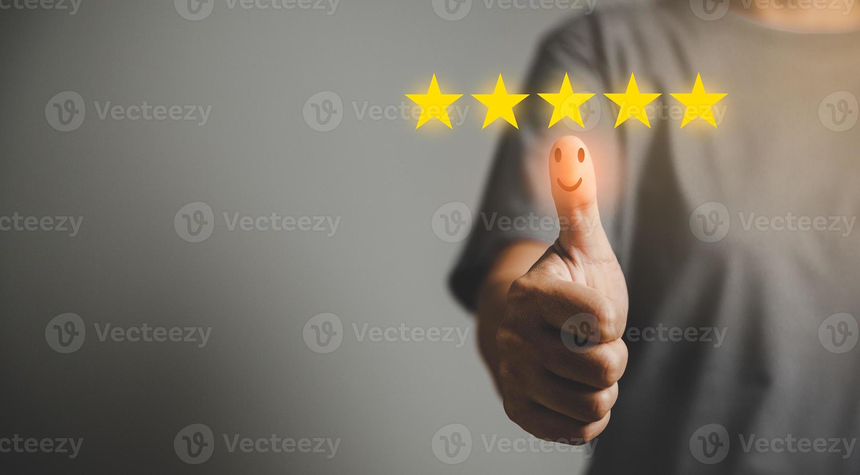 Hand with thumb up positive emotion smiley face icon and 5 star with copy space. Emotional smiley faces showing excellent satisfaction. rating very impressed. Customer service and satisfaction concept photo