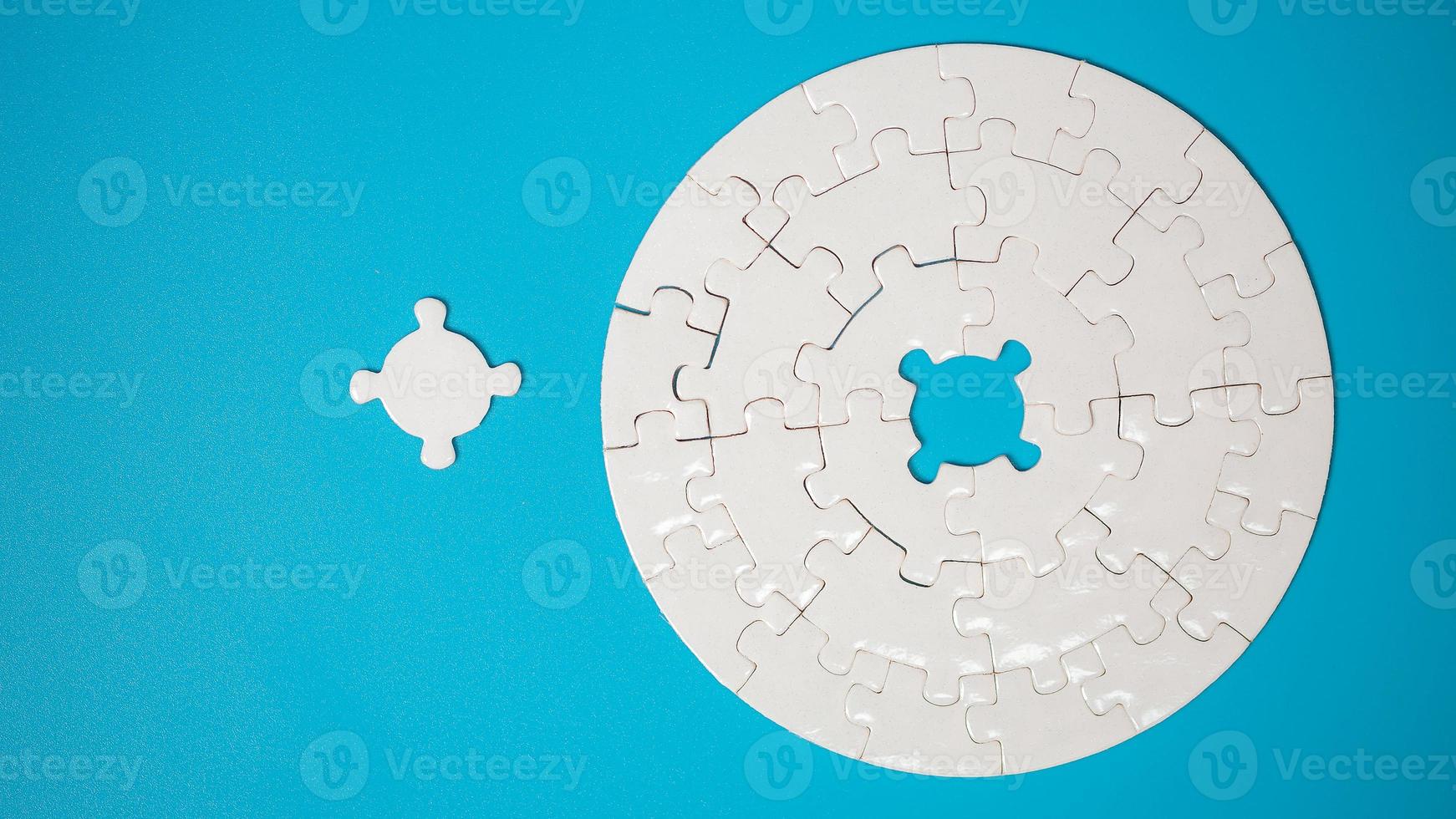 White part of jigsaw puzzle pieces on blue background. concepts of problem solving, business success, teamwork, Team playing jigsaw game incomplete, Texture photo with copy space for text