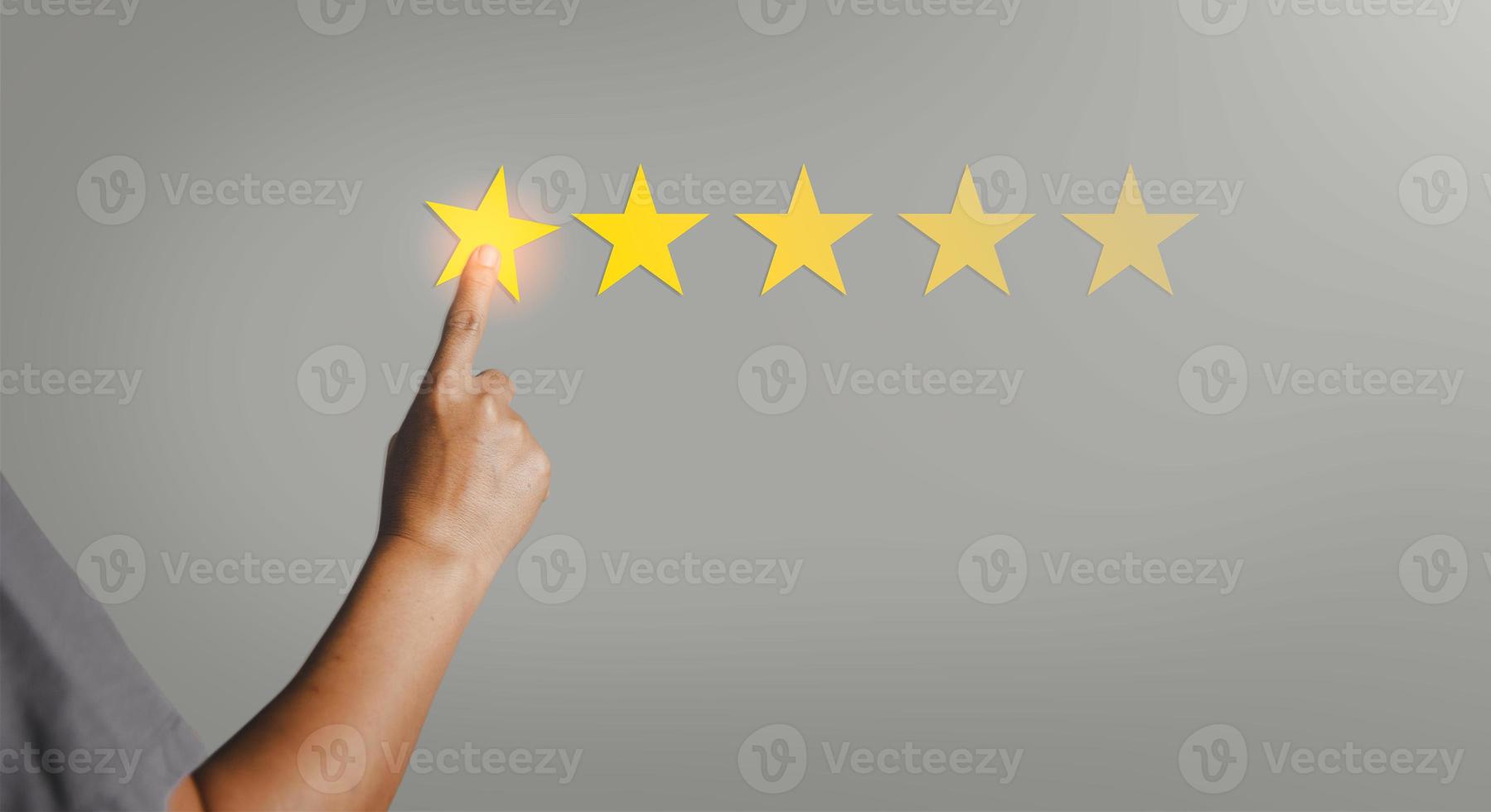 Customer service feedback. Business person are touching the virtual screen on happy Smiley face icon to give satisfaction in service. Customer service and Satisfaction concept, rating very impressed. photo