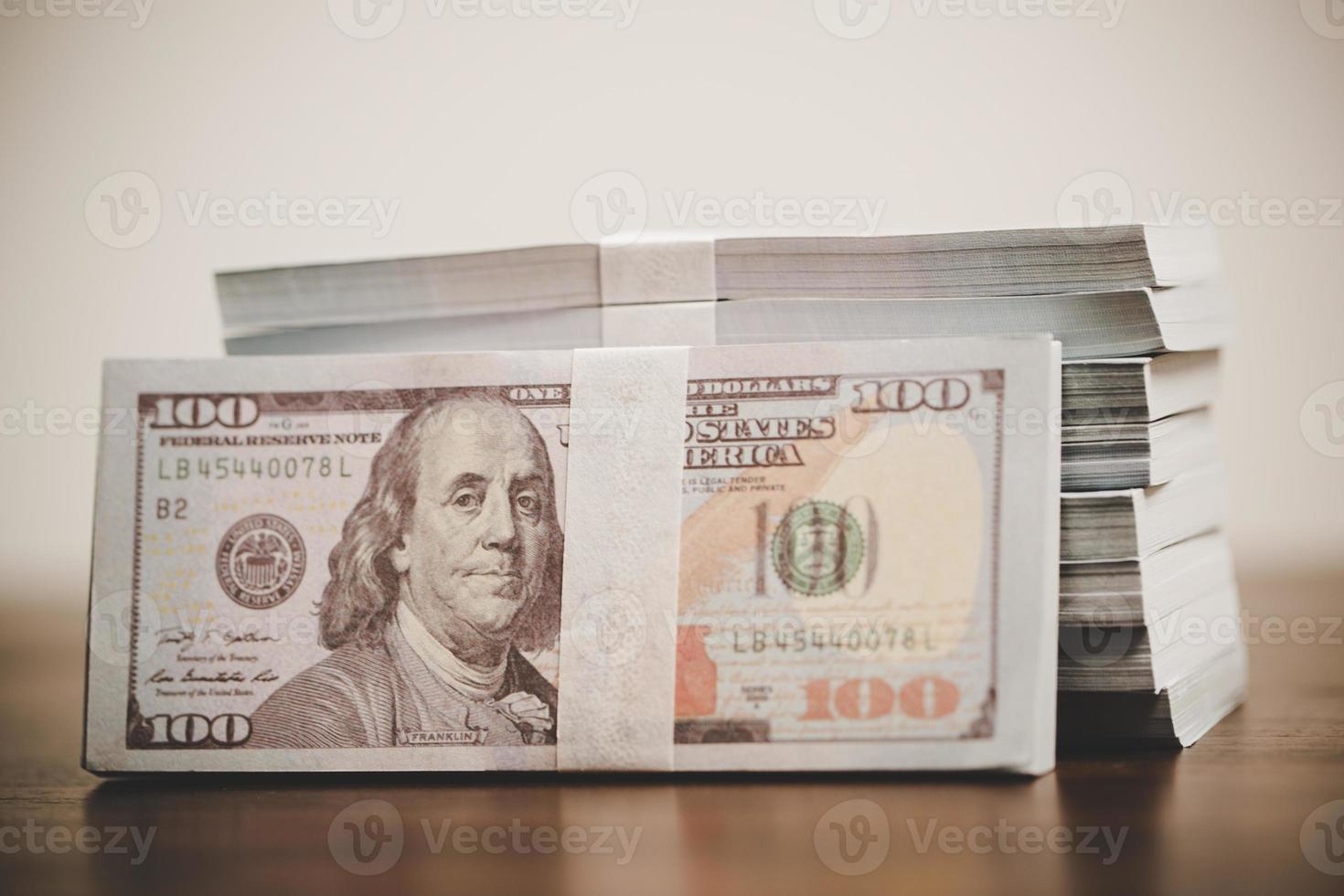 close up many banknote 100 us dollar - american currency, bill cash money background, concept for finance bank, success business investment, wealth rich, saving photo