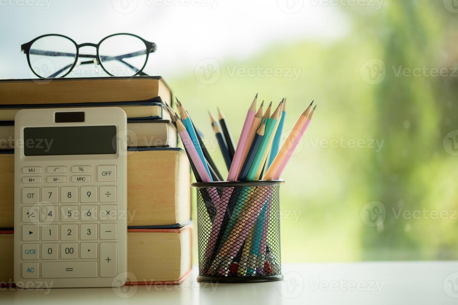 Object education green nature background with stack of ancient books or old bible, open paper book on wooden table with copy space. concept of back to school, research study photo