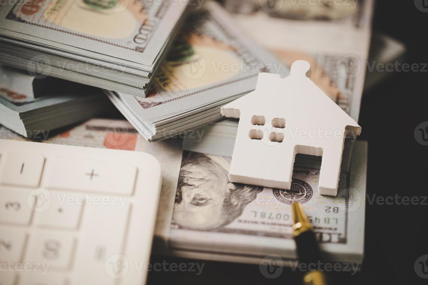 house property mortgage with cash money dollar bill on table concept of business finance, saving for buy home, investment loan, american currency, sale estate, bank payment, sell-rent real estate photo