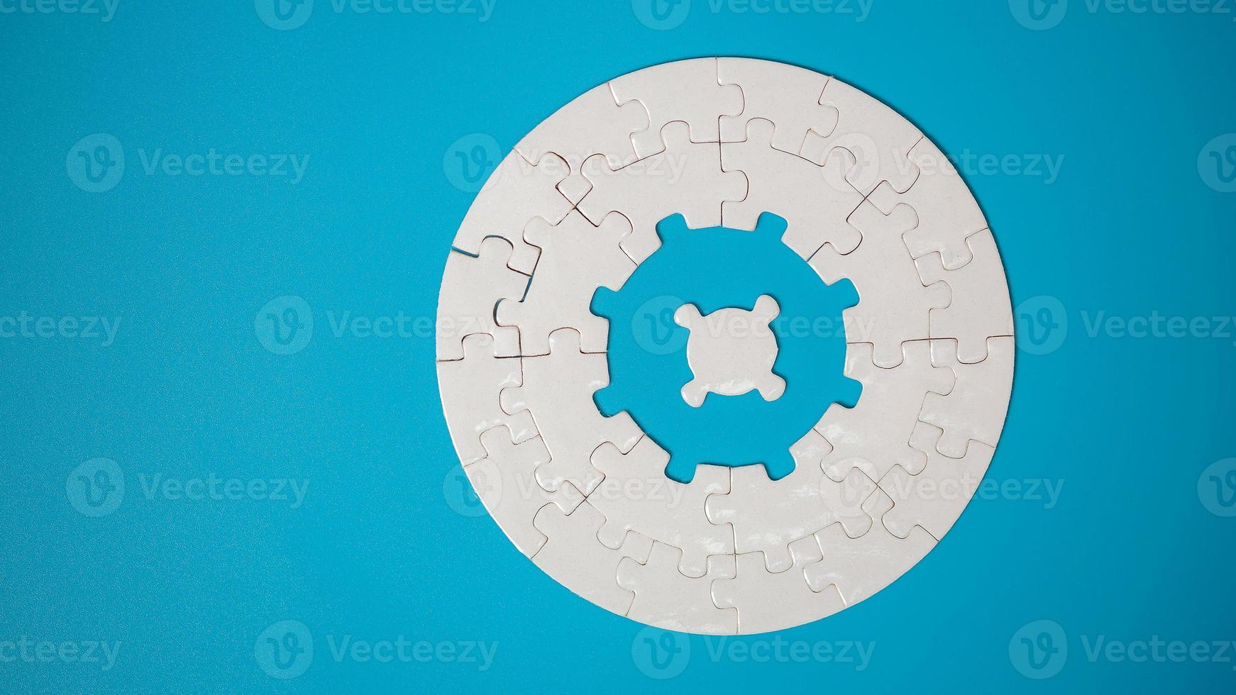 White part of jigsaw puzzle pieces on blue background. concepts of problem solving, business success, teamwork, Team playing jigsaw game incomplete, Texture photo with copy space for text