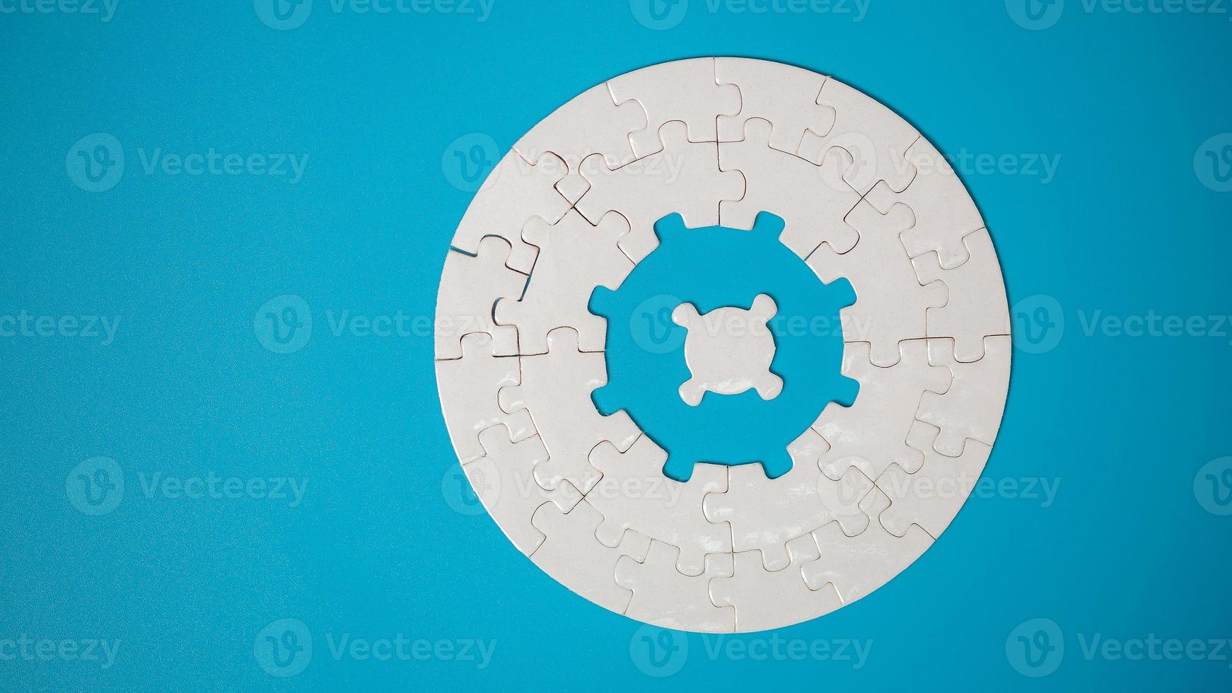 White part of jigsaw puzzle pieces on blue background. concepts of problem solving, business success, teamwork, Team playing jigsaw game incomplete, Texture photo with copy space for text