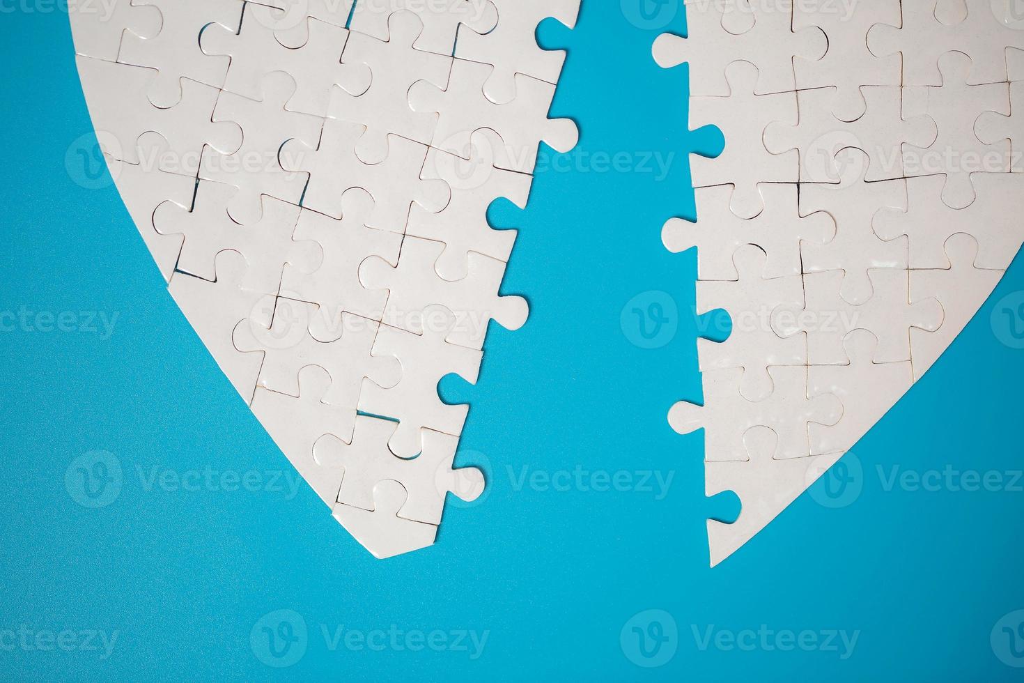 White part of jigsaw puzzle pieces on blue background. concepts of problem solving, business success, teamwork, Team playing jigsaw game incomplete, Texture photo with copy space for text