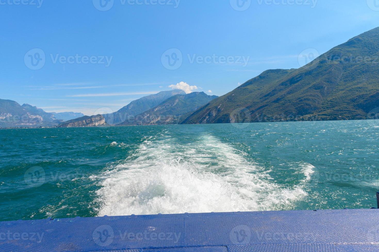 Splashing wake after ferry on Lake Garda photo