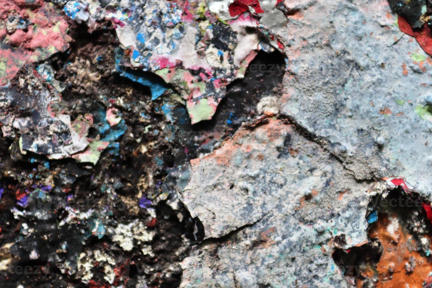 Detailed close up view on aged concrete walls with cracks and lots of structure photo