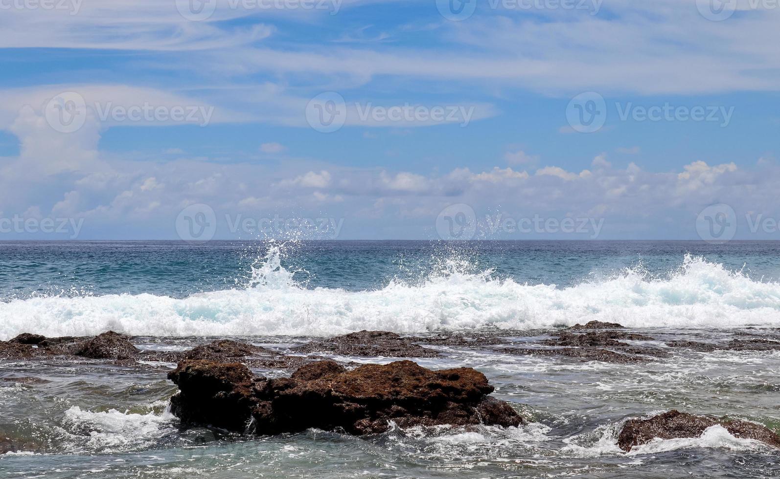 Stunning indian ocean waves at the beaches on the paradise island seychelles photo