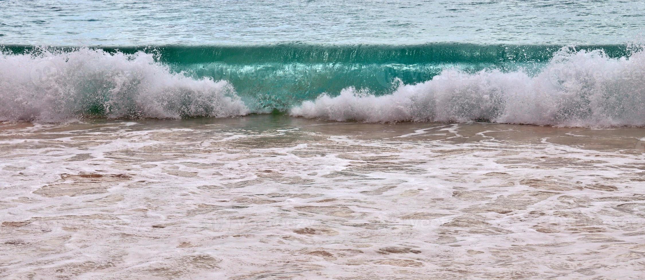 Stunning indian ocean waves at the beaches on the paradise island seychelles photo