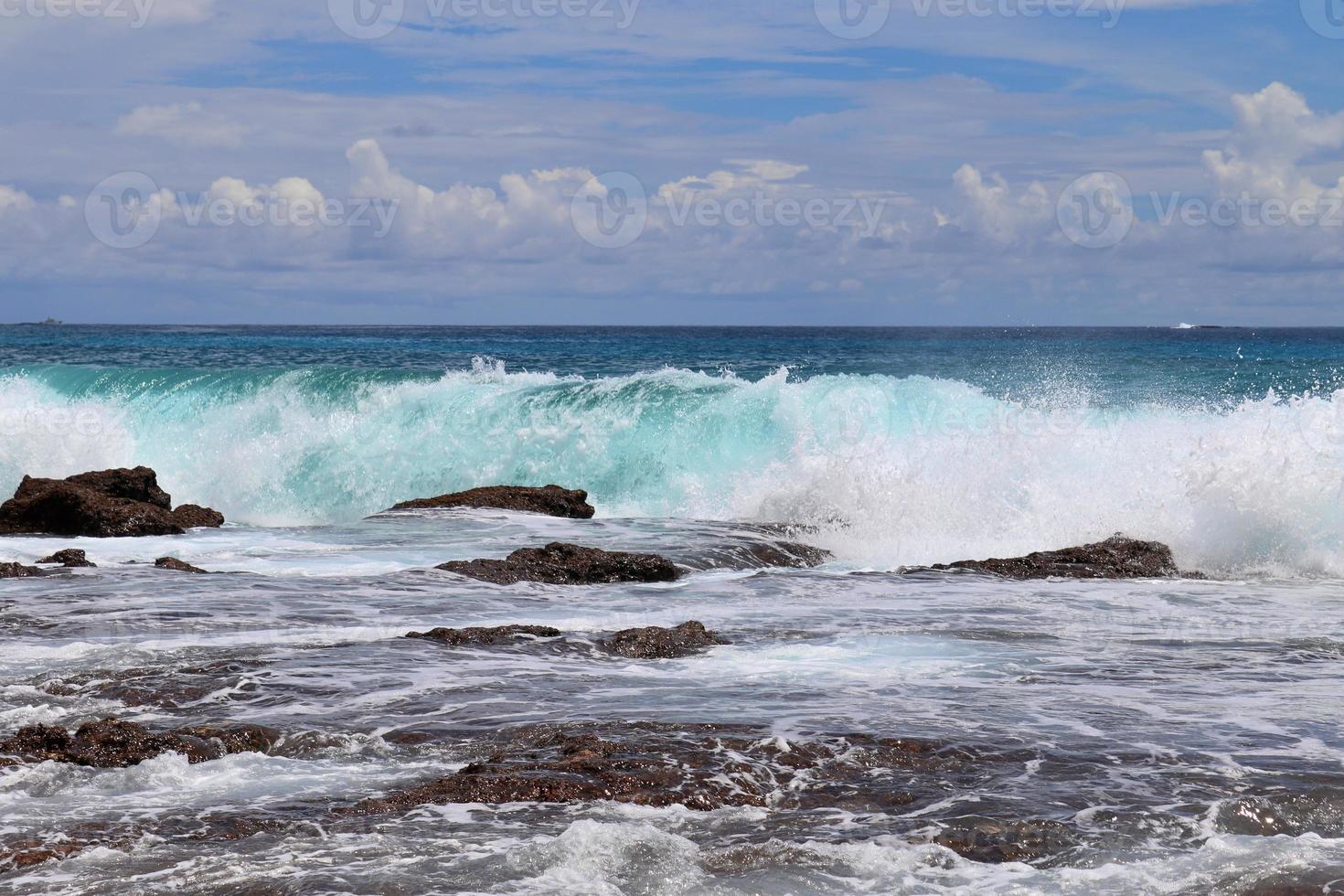 Stunning indian ocean waves at the beaches on the paradise island seychelles photo