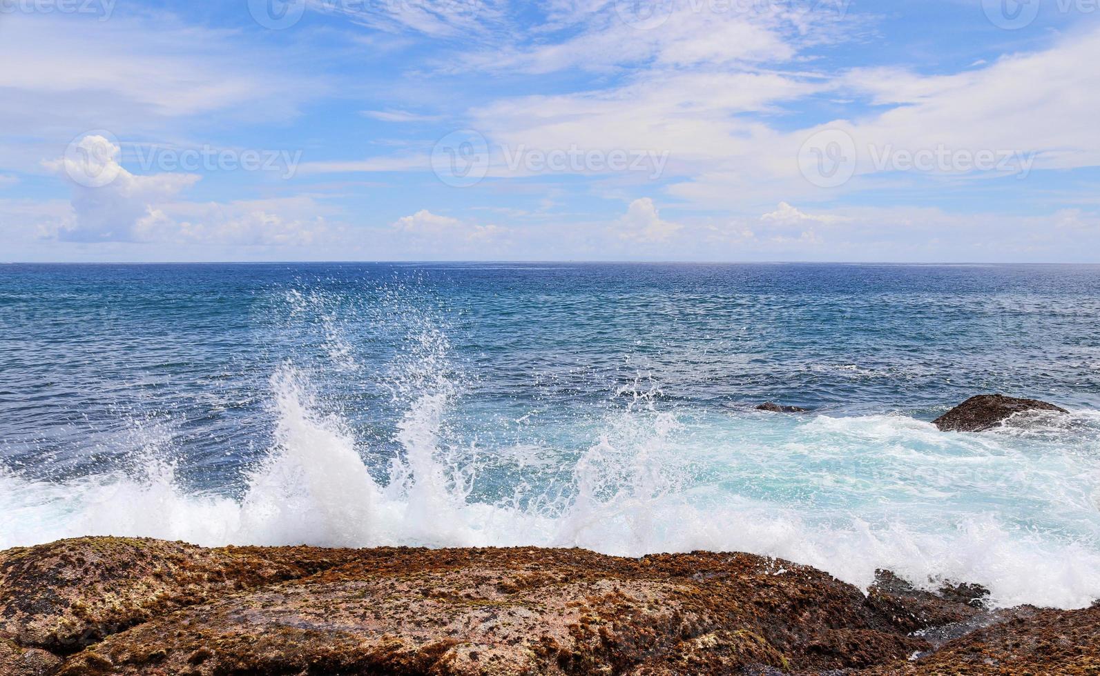 Stunning indian ocean waves at the beaches on the paradise island seychelles photo