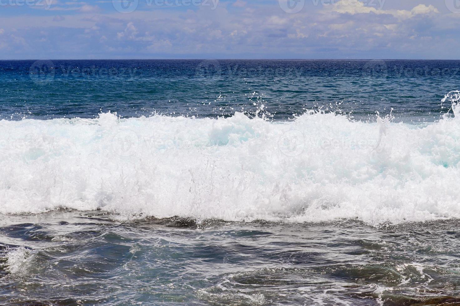 Stunning indian ocean waves at the beaches on the paradise island seychelles photo