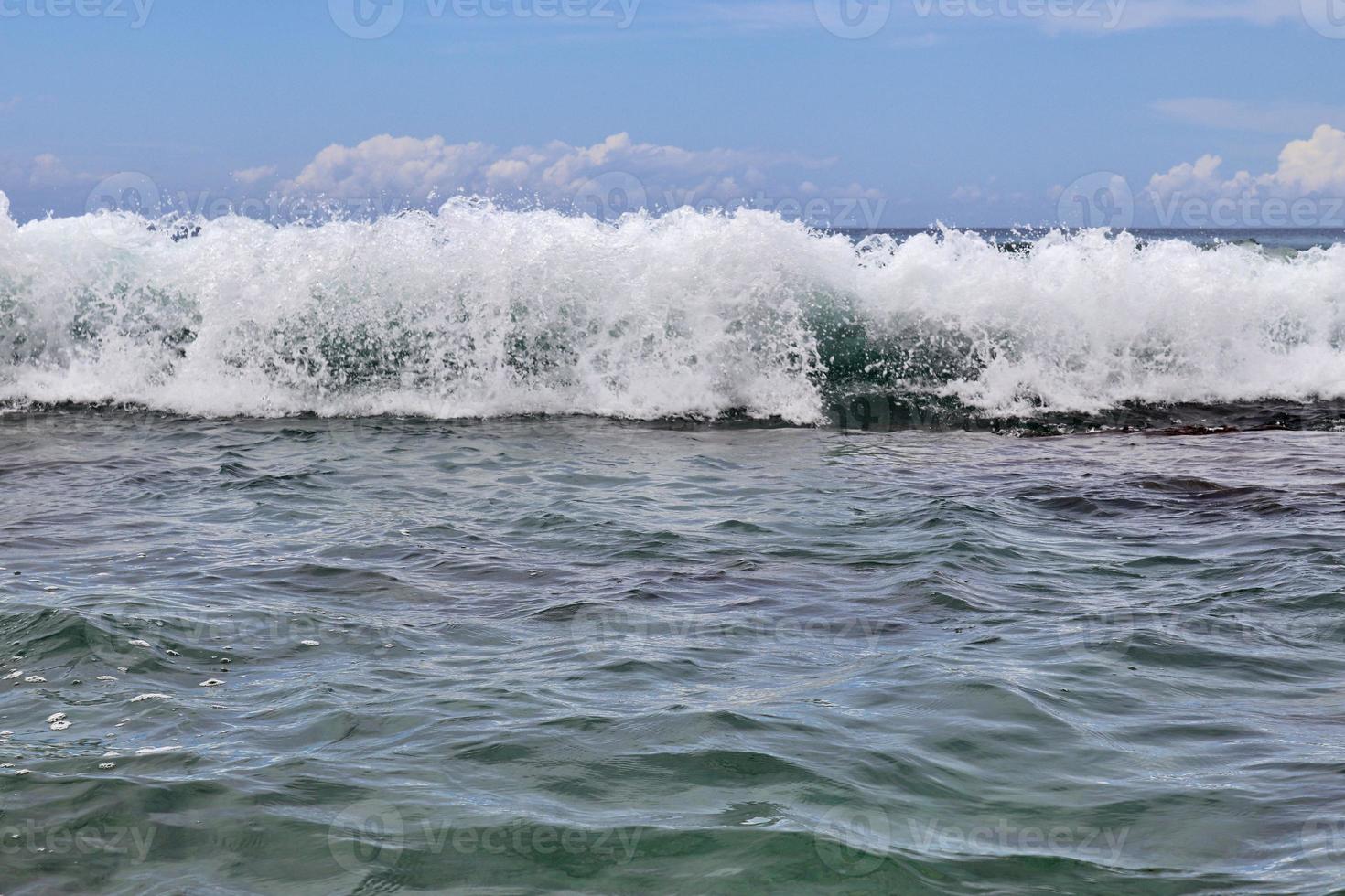 Stunning indian ocean waves at the beaches on the paradise island seychelles photo