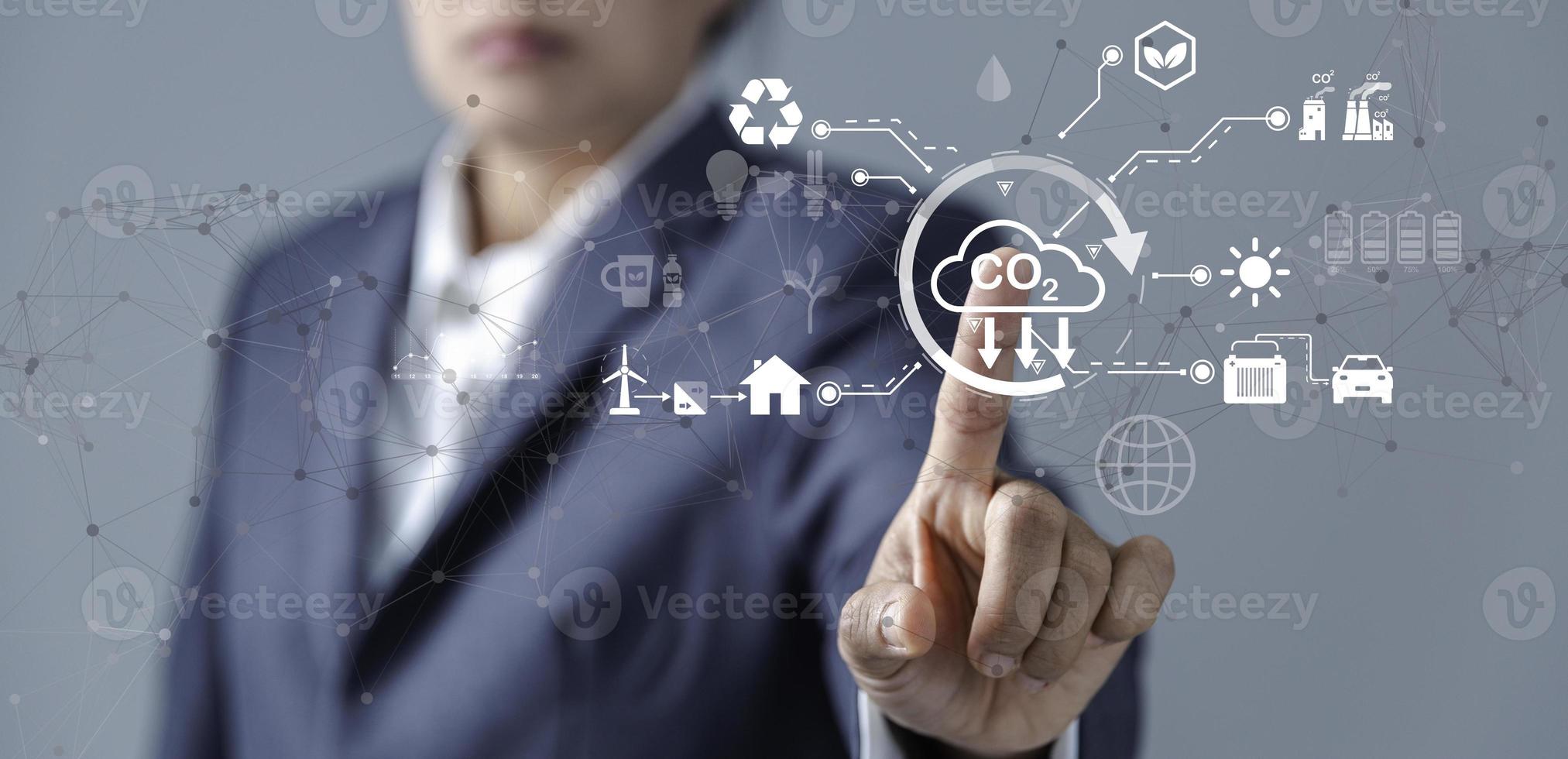 Sustainable development and innovation green business concept. Businesswoman working virtual globe modern computer to reduce CO2 emissions carbon footprint climate change to limit global warming. photo