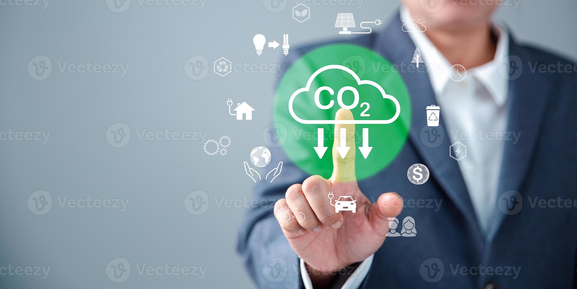 Sustainable development and innovation green business concept. Businesswoman working virtual globe modern computer to reduce CO2 emissions carbon footprint climate change to limit global warming. photo