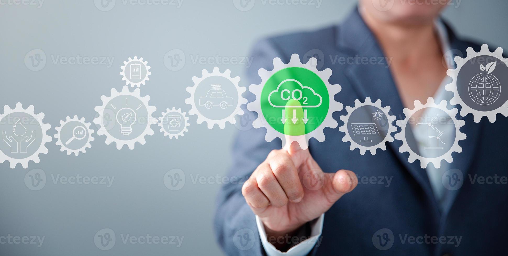 Sustainable development and innovation green business concept. Businesswoman working virtual globe modern computer to reduce CO2 emissions carbon footprint climate change to limit global warming. photo