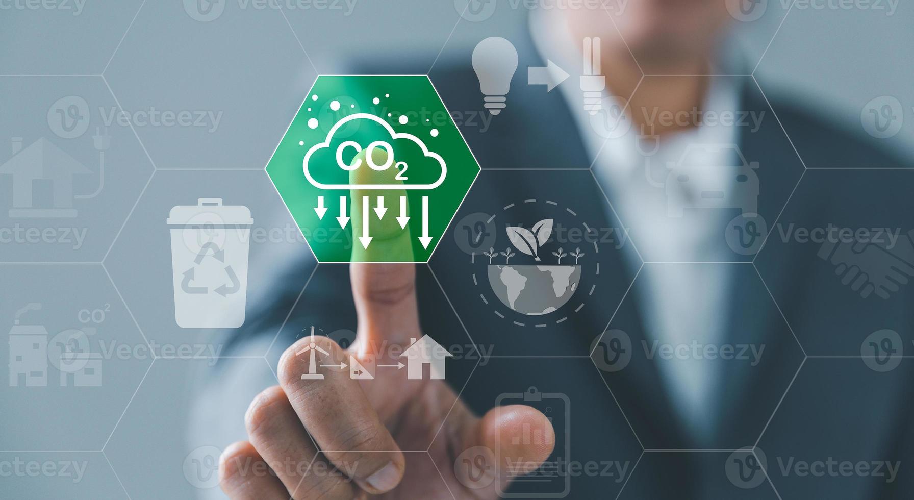 Sustainable development and innovation green business concept. Businesswoman working virtual globe modern computer to reduce CO2 emissions carbon footprint climate change to limit global warming. photo