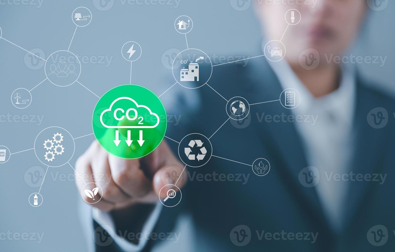 Sustainable development and innovation green business concept. Businesswoman working virtual globe modern computer to reduce CO2 emissions carbon footprint climate change to limit global warming. photo