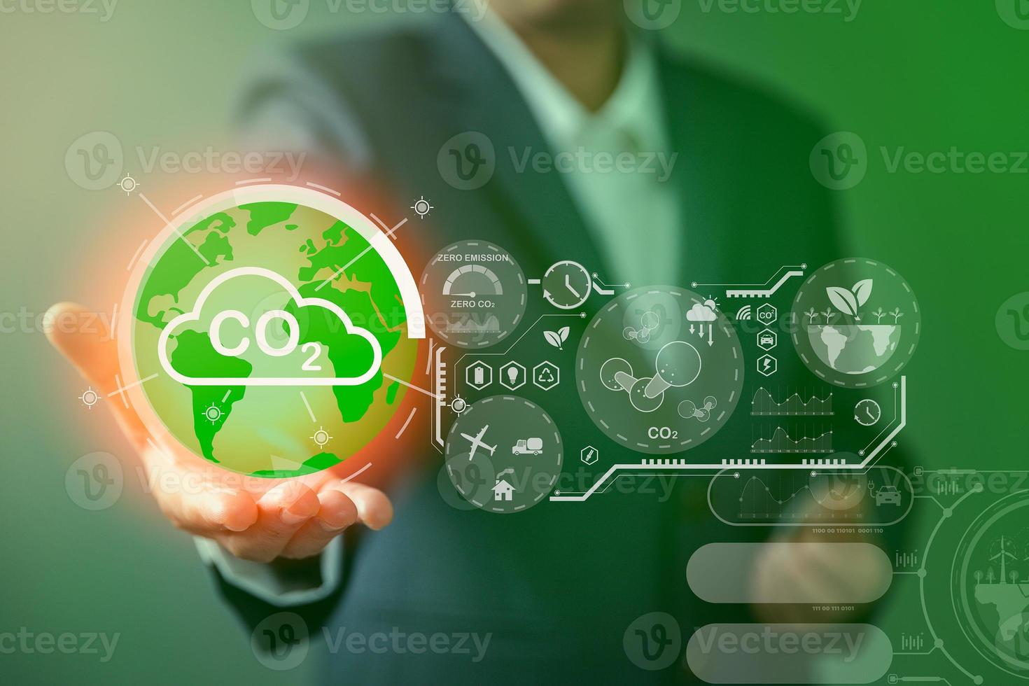 Sustainable development and innovation green business concept. Businesswoman working virtual globe modern computer to reduce CO2 emissions carbon footprint climate change to limit global warming. photo