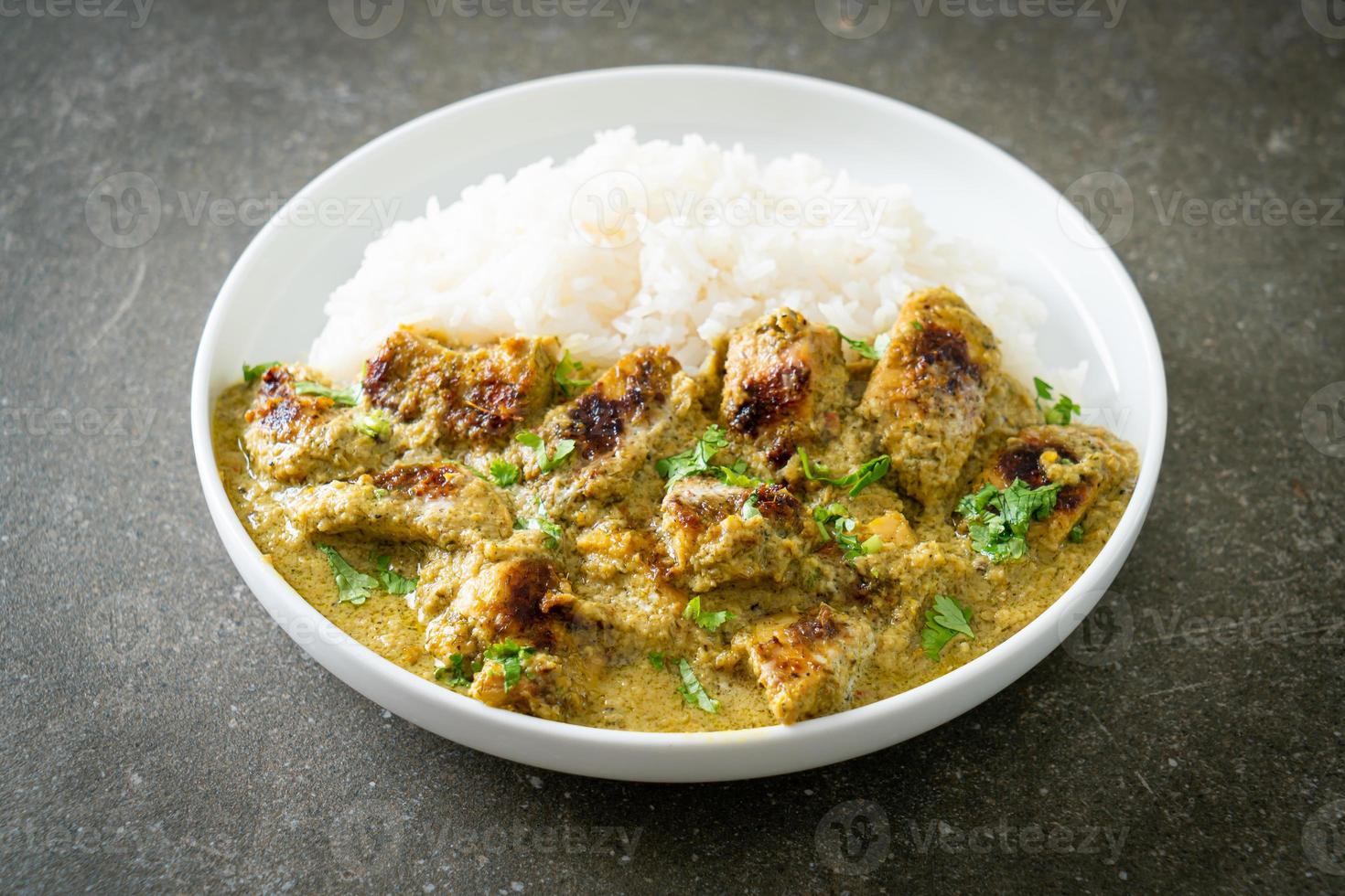 Afghani chicken in green curry or Hariyali tikka chicken hara masala with rice photo
