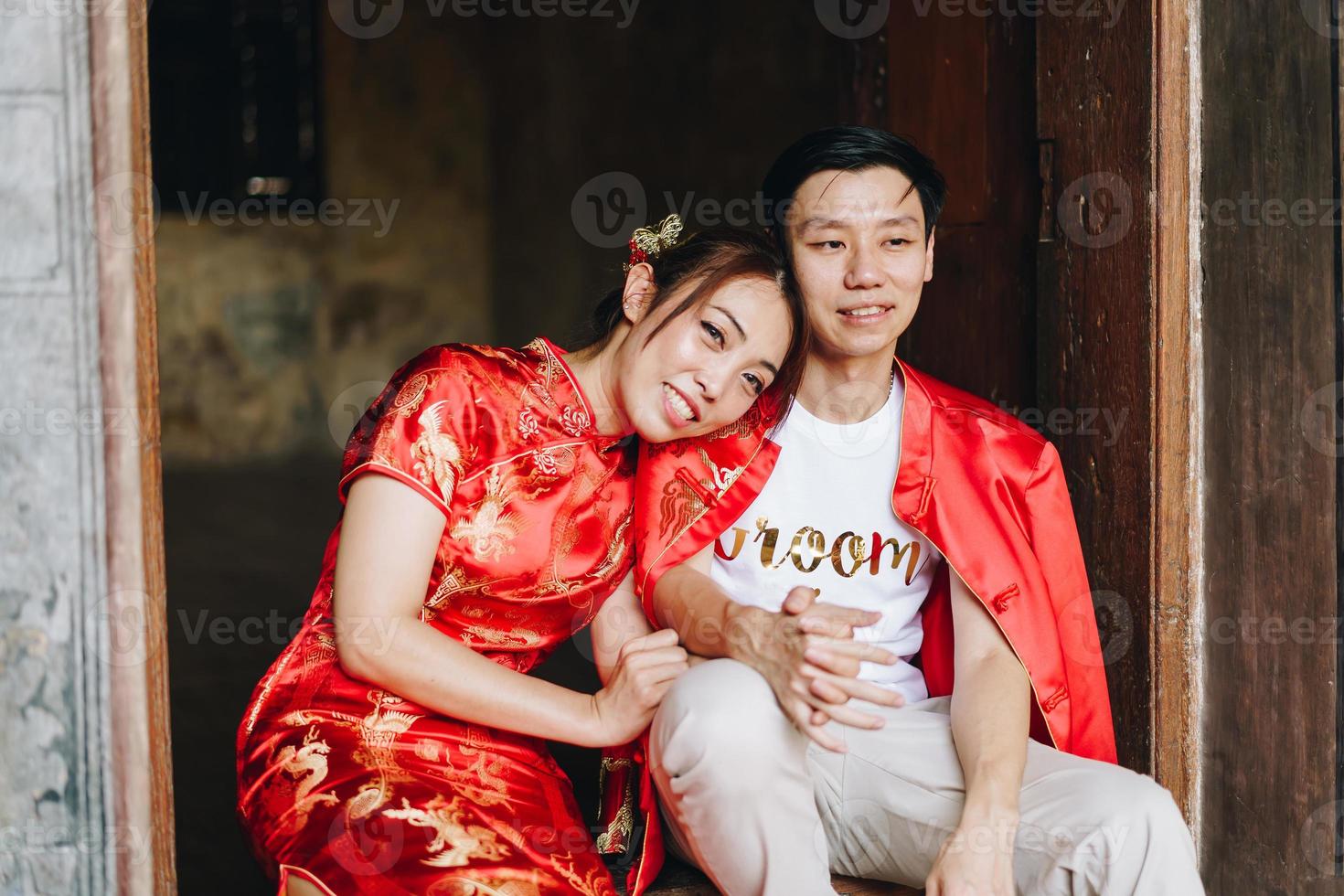 Happy young Asian couple in Chinese traditional dresses photo