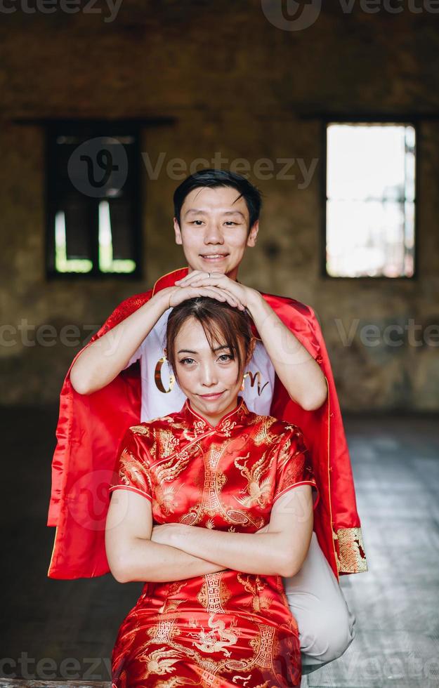 Happy young Asian couple in Chinese traditional dresses photo