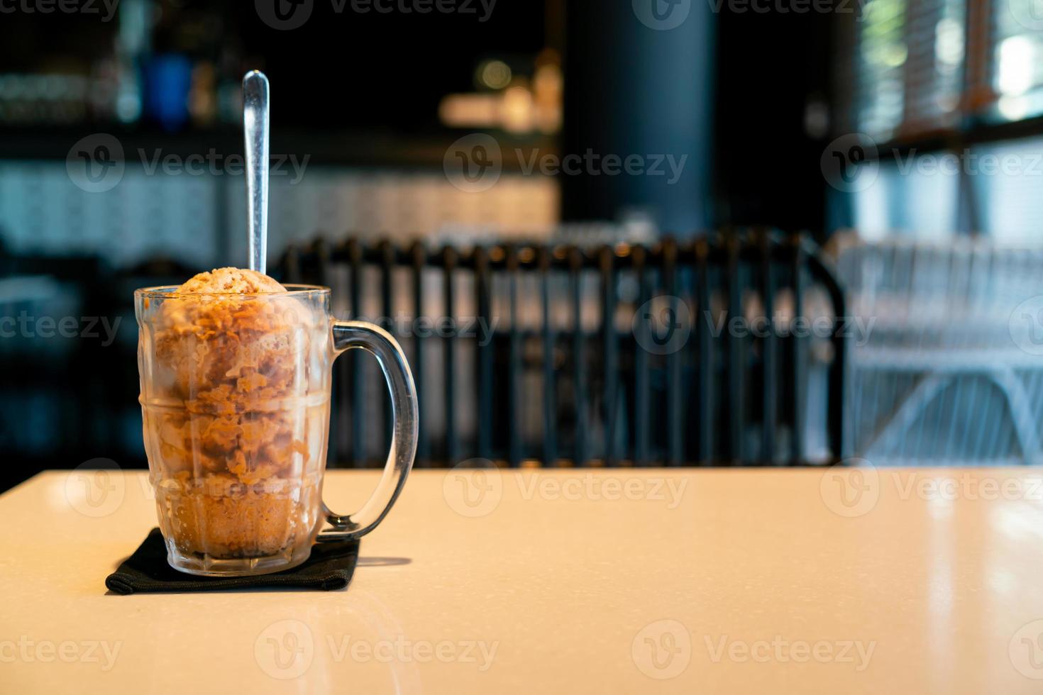 Thai tea ice scoop in glass photo