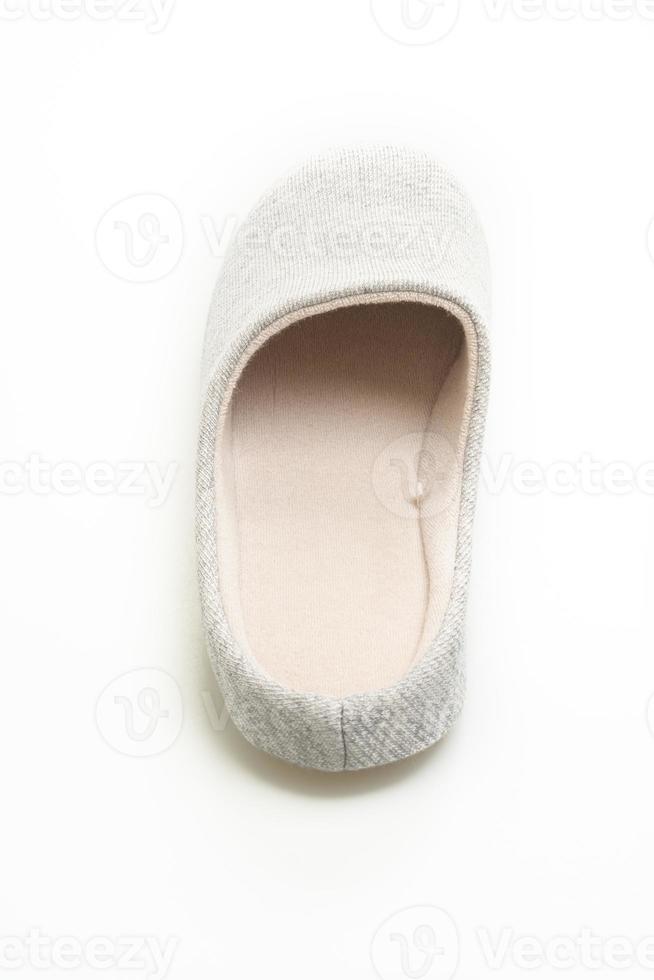 grey slipper on white background photo