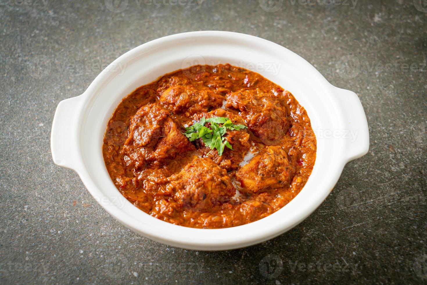chicken tikka masala spicy curry meat food with roti or naan bread photo