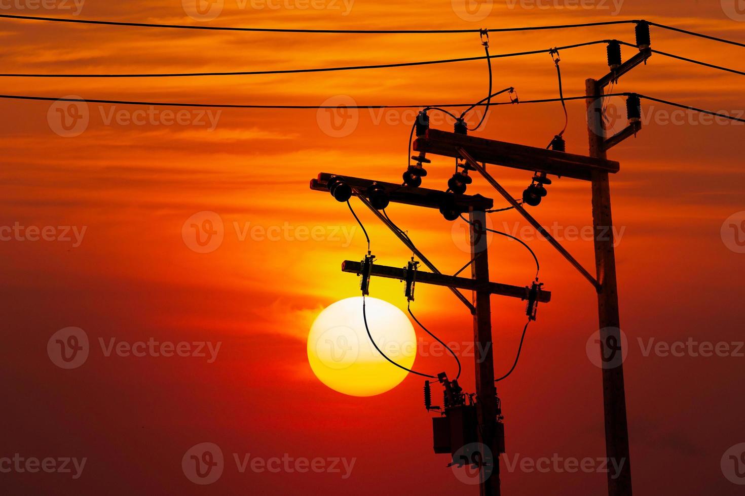 electric pole at sunset photo