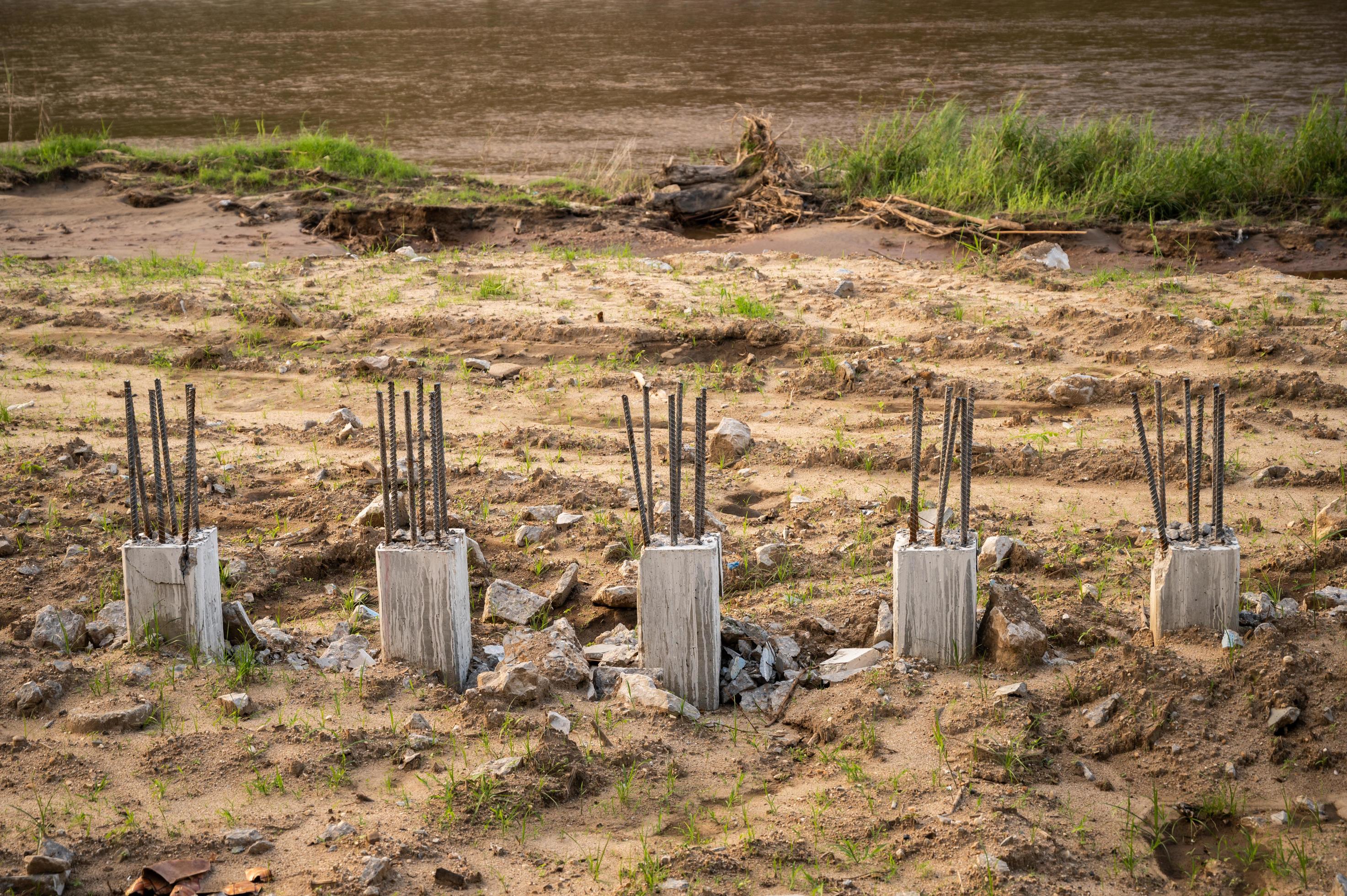 Rows of concrete piles foundation drilling in the ground in