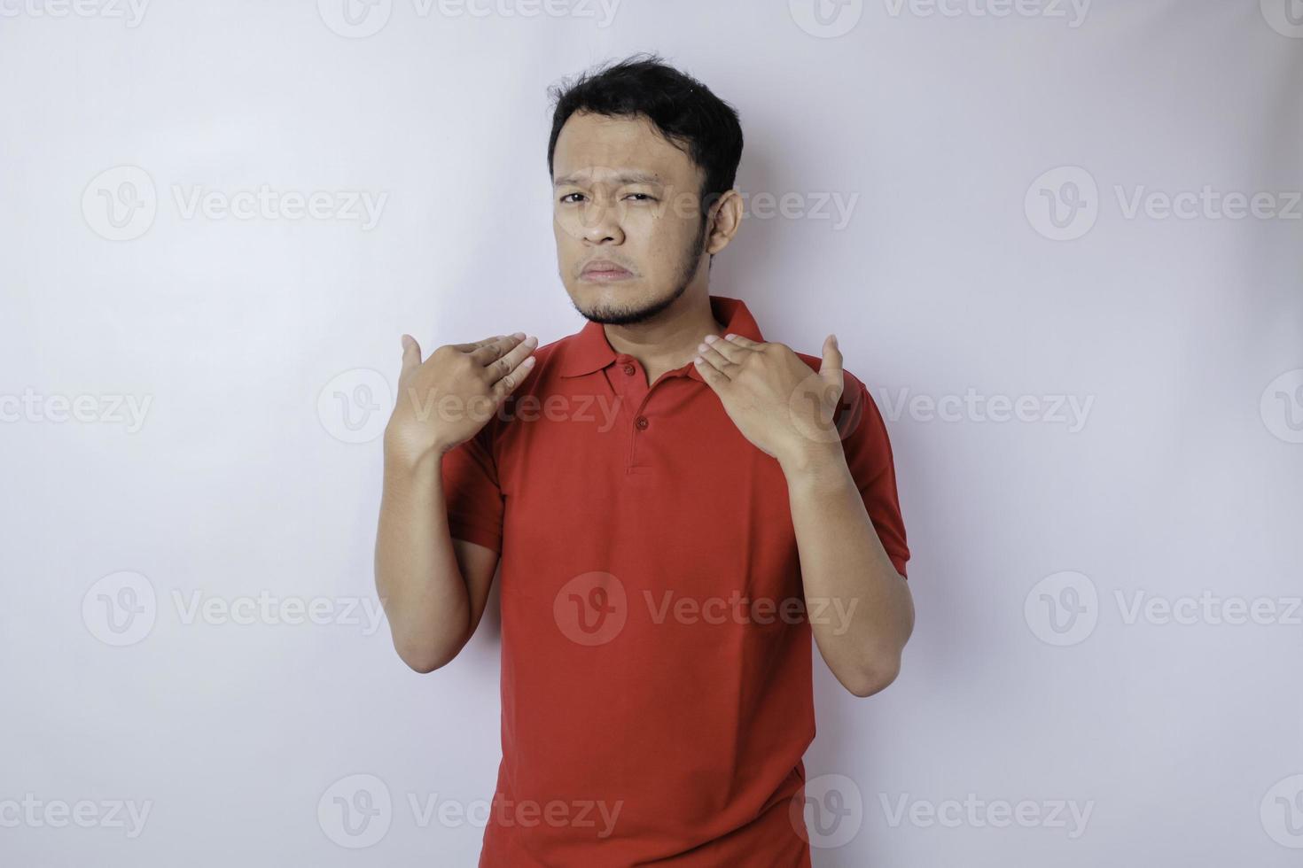 Attractive Asian man with hand gesture pose rejection or prohibition with copy space photo