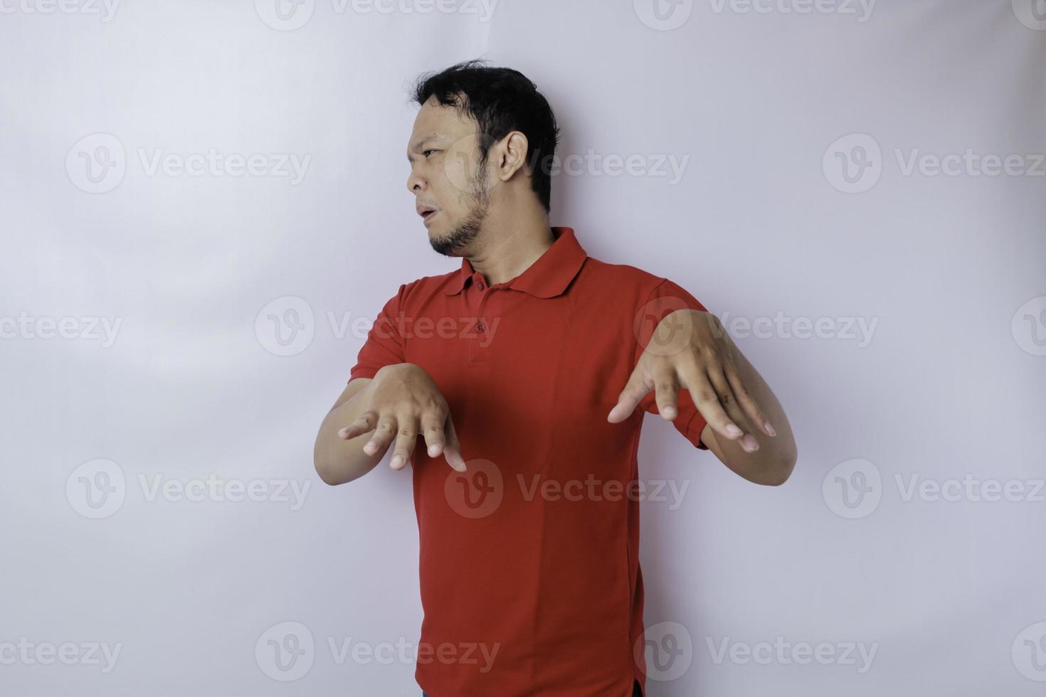 Attractive Asian man with hand gesture pose rejection or prohibition with copy space photo