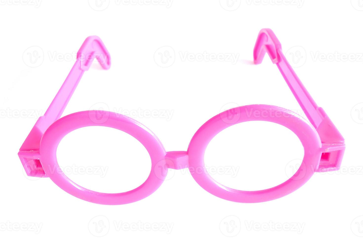 Toy of pink plastic glasses for children isolated on white background. photo